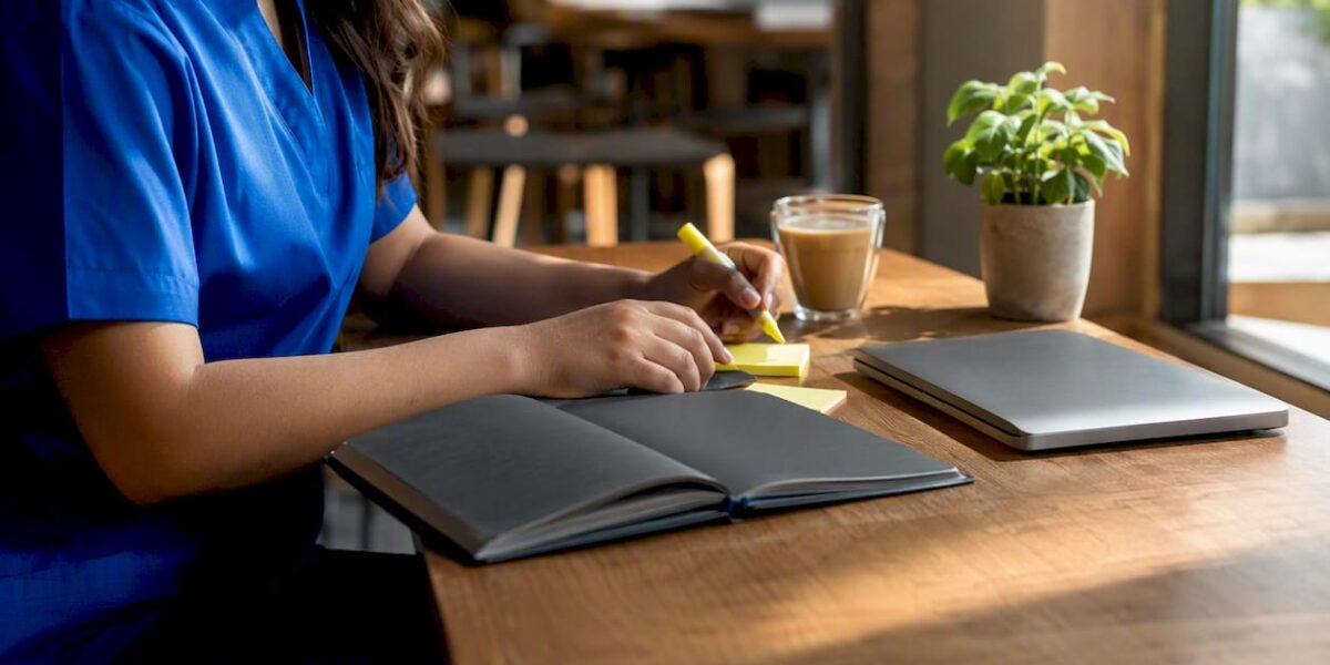 Study desk with nursing exam prep items